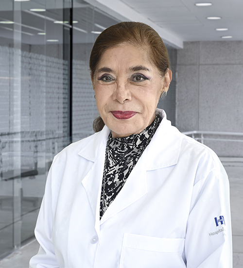 Es la foto de perfil de una cirujana plástica en Villahermosa de Hospital Angeles Villahermosa. Usa una bata blanca y un collar de perlas. Tiene el cabello recogido y castaño.