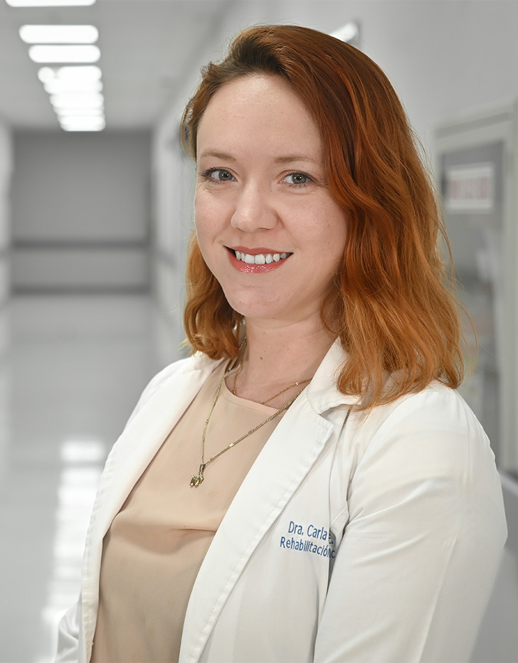 Es la foto de perfil de una especialista en neurofisiología en Ciudad de México de Hospital Angeles Universidad. Usa una bata blanca con una blusa color camel. Tiene el cabello corto y pelirrojo.