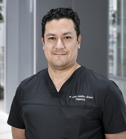 Es la foto de perfil de un psiquiatra en Huixquilucan de Hospital Angeles Lomas. Usa un uniforme médico negro, tiene el cabello rizado negro y está sonriendo.